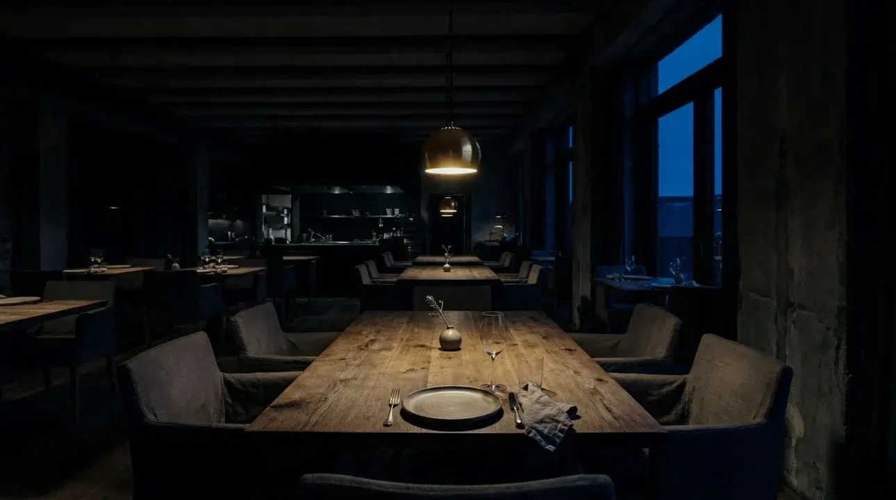 Fjeld's serene dining room with empty tables awaiting guests, soft natural lighting highlighting the minimalist Nordic design